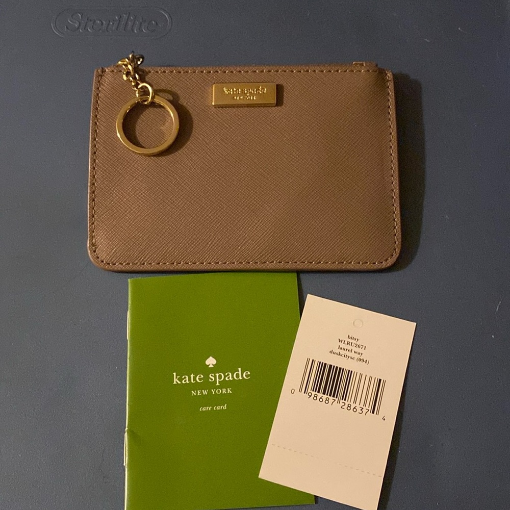 Kate Spade  small cardholder with coin purse.  brown in color.